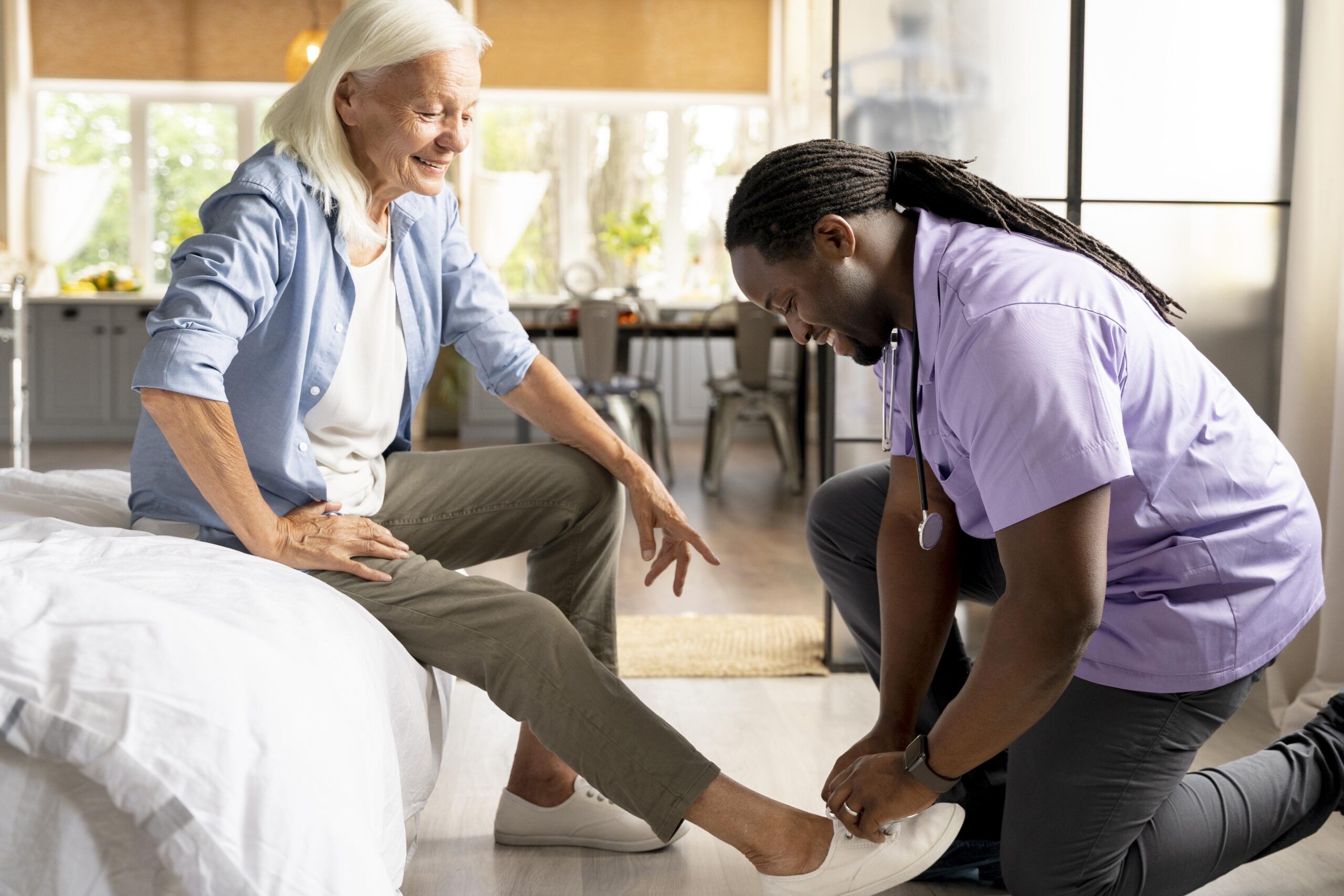 african-social-worker-taking-care-senior-woman