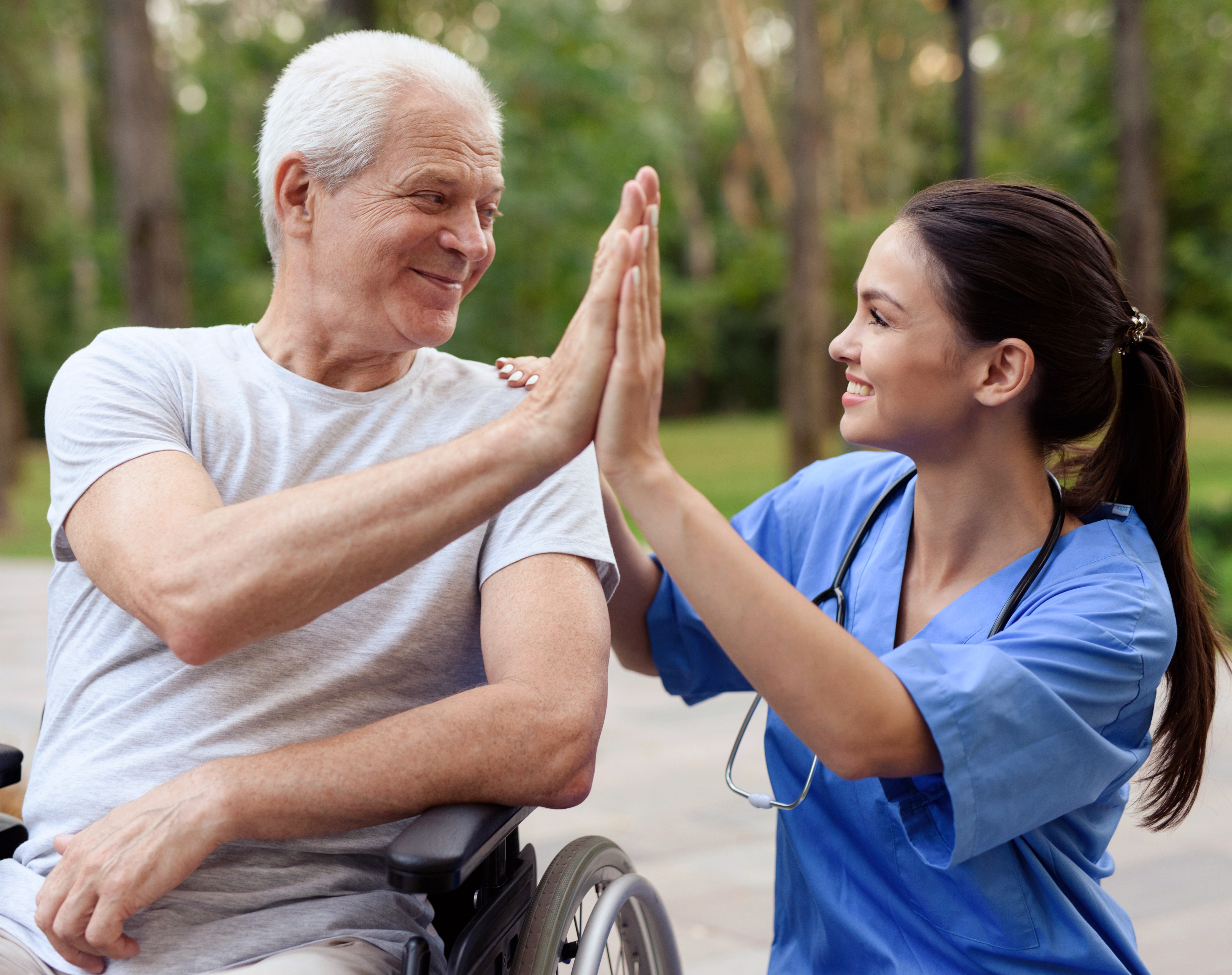 nurse-old-man-wheelchair-high-five